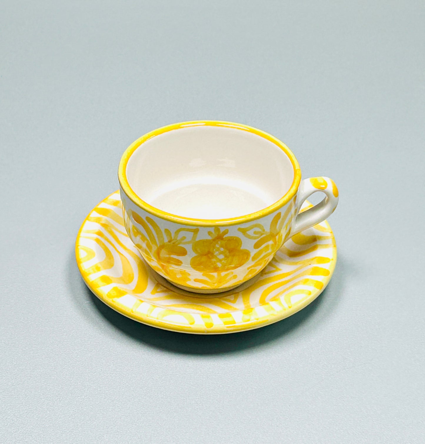 Kaffeetasse mit Untertasse "Blumen von Granada", gelb/weiß (Ø Tasse: 9 cm, Ø Untertasse: 13 cm Höhe: 6 cm)