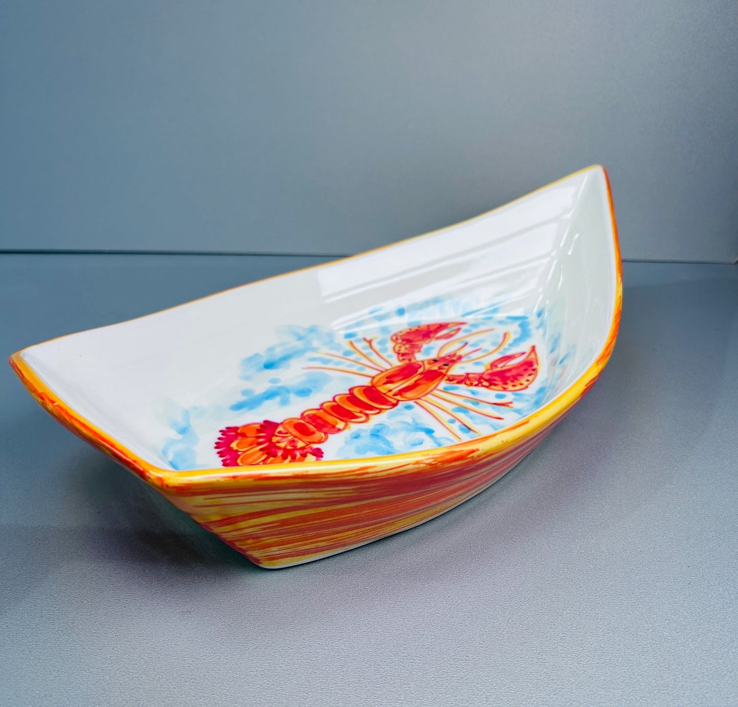 Schale in Bootsform "Fred der Hummer", außen orange (Länge: 34 cm Breite: 19 cm Höhe: max. 9 cm)